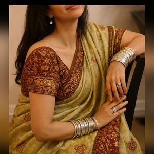 Elegant Gold & Maroon Traditional Saree – Intricate Embroidery with Rich Border